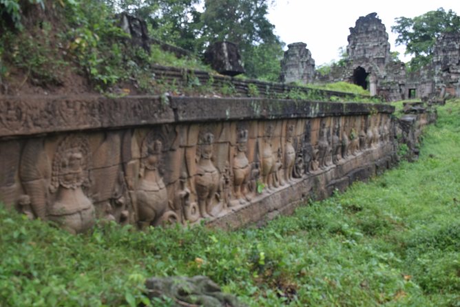 2-D Angkor temple tour with one sunrise in A/C vehicle and guide. - Story stops that make the stones make sense: Victory Gate, Neak Poan, and Preah Khan