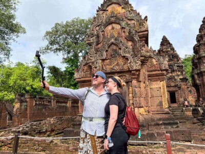 2-Day Angkor Wat, Kulen Mountain, Beng Mealea and Tonle Sap - Angkor Thom + Ta Prohm: smiling faces, elephant terraces, and a temple that looks half-wild