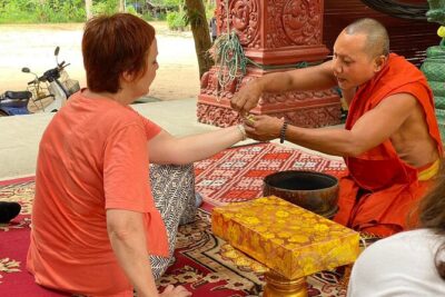 Buddhist Monastery with Monks Water Blessing - Stop in Siem Reap Province: Chanting, Blessing Water, and a Quick Lesson