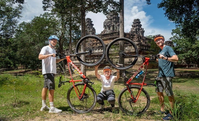 Cycle Angkor Backroad Bike Tour / E-Bike or Tuk Tuk - Riding into Angkor Thom: the ancient gate and four faces