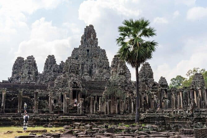 Explore Angkor Sunrise Spectacle a Full Day Temples Tour - Angkor Thom’s South Gate and breakfast: big-city energy in short time