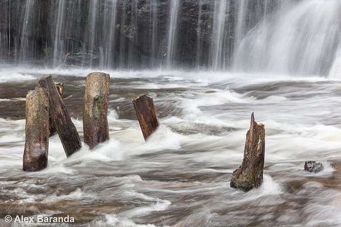 Kulen Mountain Beng Mealea and Tonle Sap Tour in Siem Reap - Phnom Kulen Waterfall: Picnic Rocks and a Cold-Water Reward