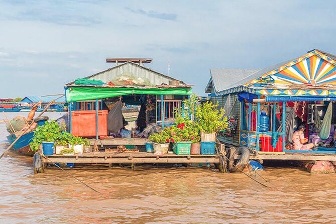 Mechrey Floating Village Tour & Mangrove from Siem Reap - Entering the Floating Khmer Village Resort: canal start, then life on the water