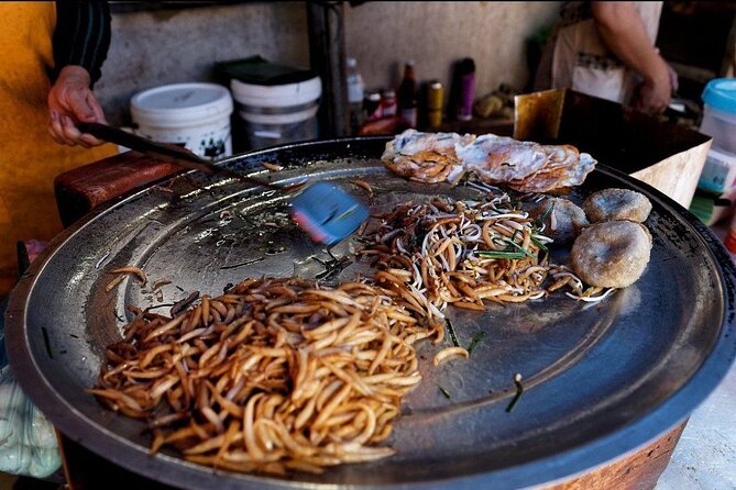 Siem Reap Authentic Breakfast and Market Tour - Stop 4 at Phsar Leu Thom Thmey: a market walk built around desserts