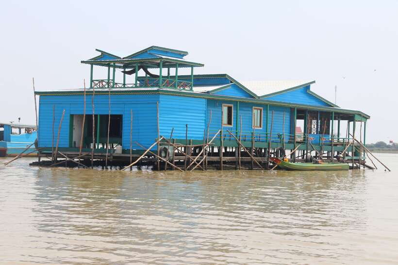 Siem Reap: Floating Village Tour - A stop on Queen Tara: drinks, fruit, and a historic dock