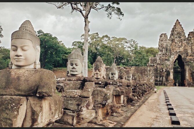 Unveil The Magic Of Angkor Wat Sunset In A Day Personalized Tours - Bayon Temple in Angkor Thom: Smiling Faces Up Close